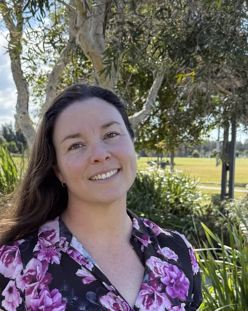 Leia Wilton smiling outdoors