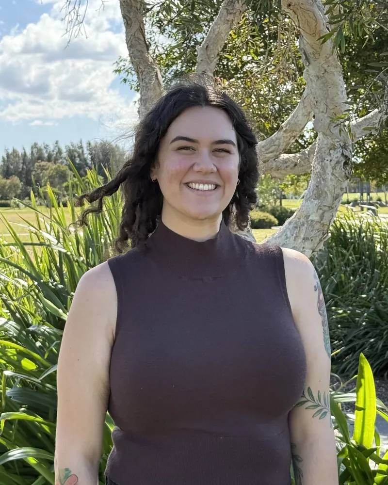 Steph smiling outdoors